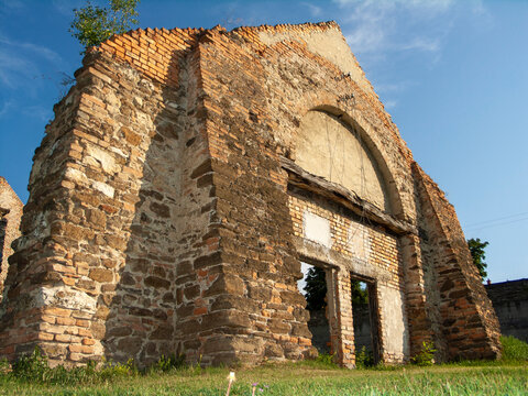 Facade of an ancient stone building in the countryside.