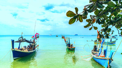 Fishing boats moored near beach in Thailand