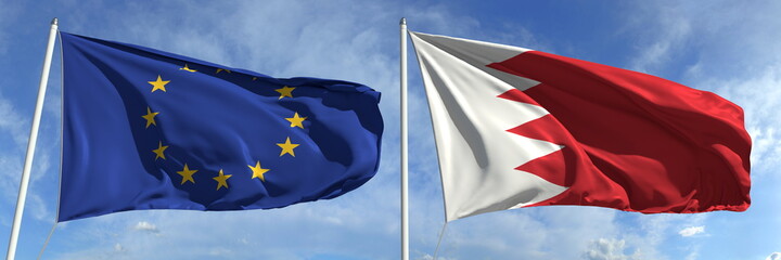 Flags of the European Union and Bahrain on flagpoles. 3d rendering