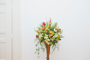 Wedding floral bouquet on white wall