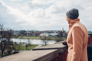 Wilsa river view from Wawel Castle in Krakow, Poland. Man tourist walking enjoying city landscape. Europe travel