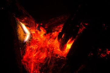 Fototapeta premium embers burn down in a hardwood fire