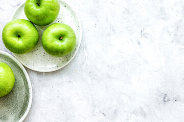 ripe green apples stone table background top view space for text