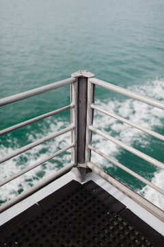 View of a wake, from a corner of the top deck of a ship
