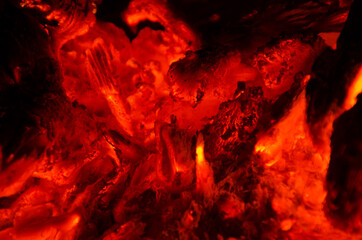 embers burn down in a hardwood fire - 380449428