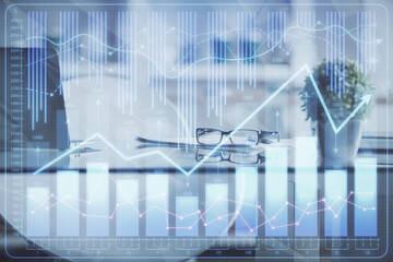Fototapeta premium Double exposure of financial graph drawing and office interior background. Concept of stock market.