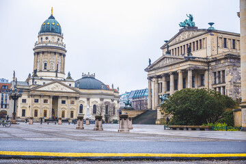 a large square in Berlin with buildings and a church with a dome