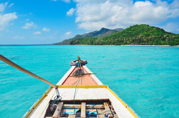 Traveling in a old wooden boat around perfect post card tropical islands