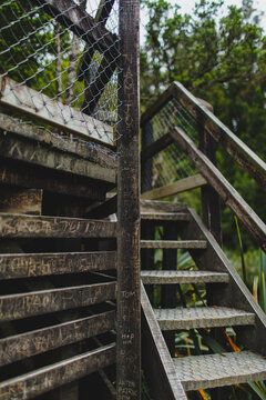 Writen planks of a wooden structure with a stair on a side