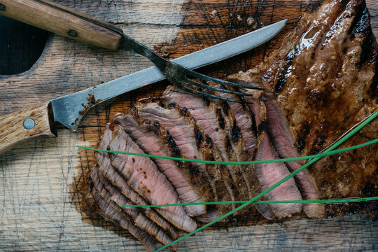 Sliced barbecued beef with fresh chives from above