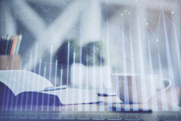 Multi exposure of forex graph drawing and desktop with coffee and items on table background. Concept of financial market trading