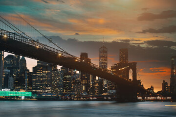 Brooklyn Bridge Manhattan sunset beautiful cityscape over East River at New York US