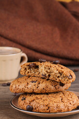 Oatmeal cookies, a cup of coffee and coffee beans. Cozy mood.