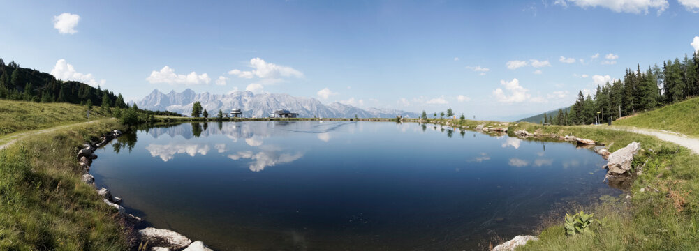 Panorama of a lake with mountain Dachstein on Reiteralm, austria