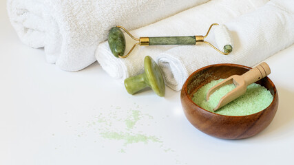 Obraz na płótnie Canvas Jade gem, roller and eucalyptus salt for face and body care, spa products.