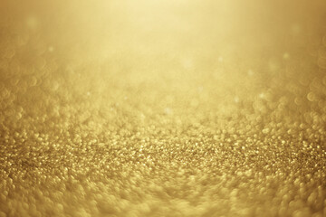 gold abstract bokeh background for Christmas.