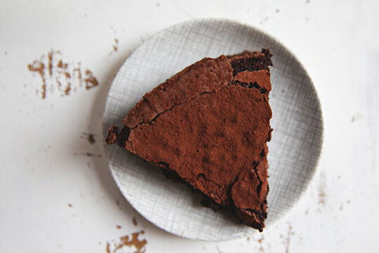 flour less chocolate cake for afternoon tea on a vintage plate