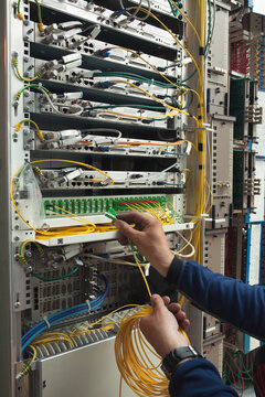 Working with optic fibre cables.
