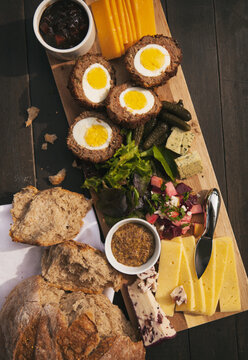 Variety Of Cheeses And Salads On British Ploughman's Plate
