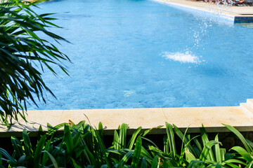 Swimming pool with spray