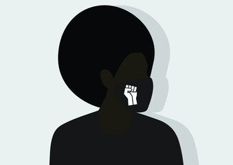 Black person with an afro wearing a face mask adorned with BLM fist