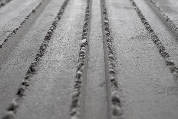 textured asphalt wall with lines