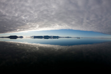 Reflections in Calm Sea, Svalbard, Norway