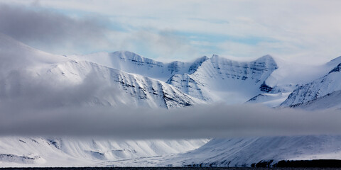 Fototapeta na wymiar Mountain Peaks and Clearning Storm, Svalbard, Norway