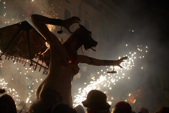 Mithological figure in a fire parade