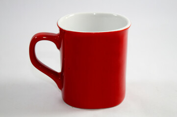 Red coffee mug with white inside.