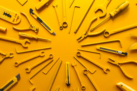 yellow work/handtools of a craftsman arranged.