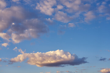 Clouds in blue sky on a sunset as a natural background.