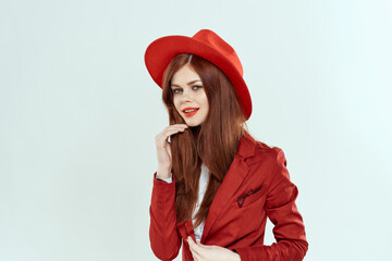 beautiful woman in red hat blazer makeup elegant style light background studio