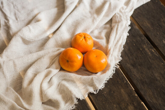 mandarin oranges resting on the table