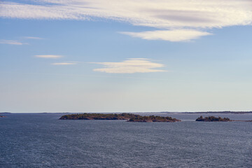 Sea scape of Turku archipelago with cloudy blue sky.