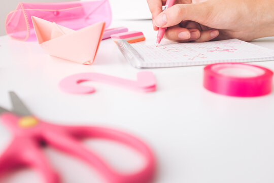 Female Student Study Chemistry Using Pink School Items
