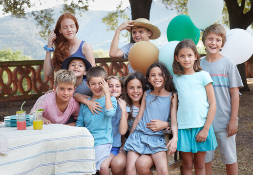 Group portrait of children in a yard party