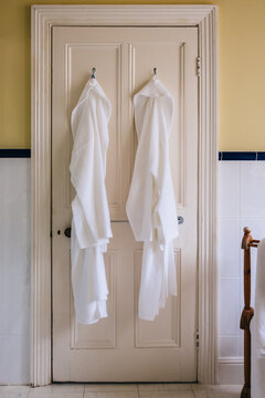 Robes hanging on a bathroom door