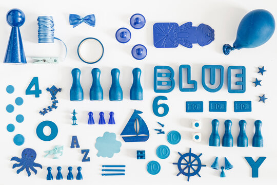 Collection of blue toys and game pieces