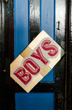 boys"" sign on a restroom door
