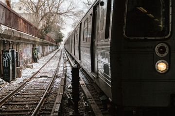 New York City subway train and rail tracks in the winter