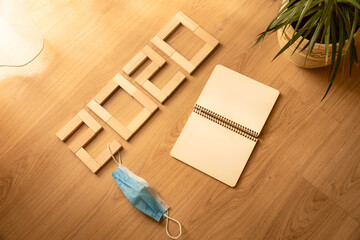 Composition banner inscription 2020 with a mask from a virus on a beautiful background