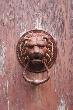 Rusty lionhead doorknocker