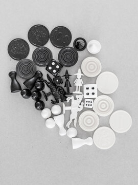 Black and white game pieces on grey background