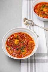 Two Bowls of Vegan Vegetable Soup  on a Gray Countertop