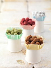 colorful hazelnut praline pave chocolate truffles in paper dish