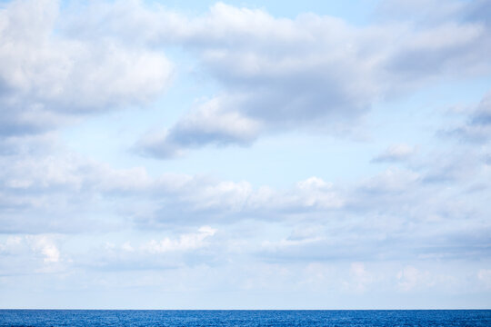 White Soft Clouds over the Horizon at Sea