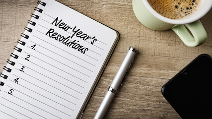 Notepad with text on it: New Year’s Resolutions