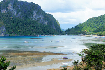 Fishing boats in the bay of a small tropical town. Philippines.