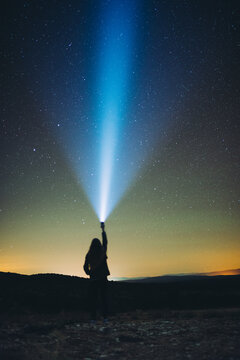 woman is looking stars with light